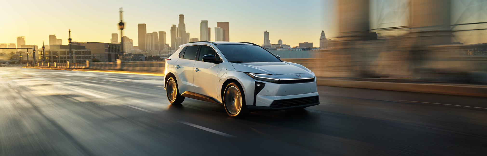 2026 Toyota bZ at Bobby Rahal Toyota in Mechanicsburg, PA | White 2026 Toyota bZ driving down the street 2026 Toyota bZ at Bobby Rahal Toyota in Mechanicsburg, PA | White 2026 Toyota bZ driving down the street