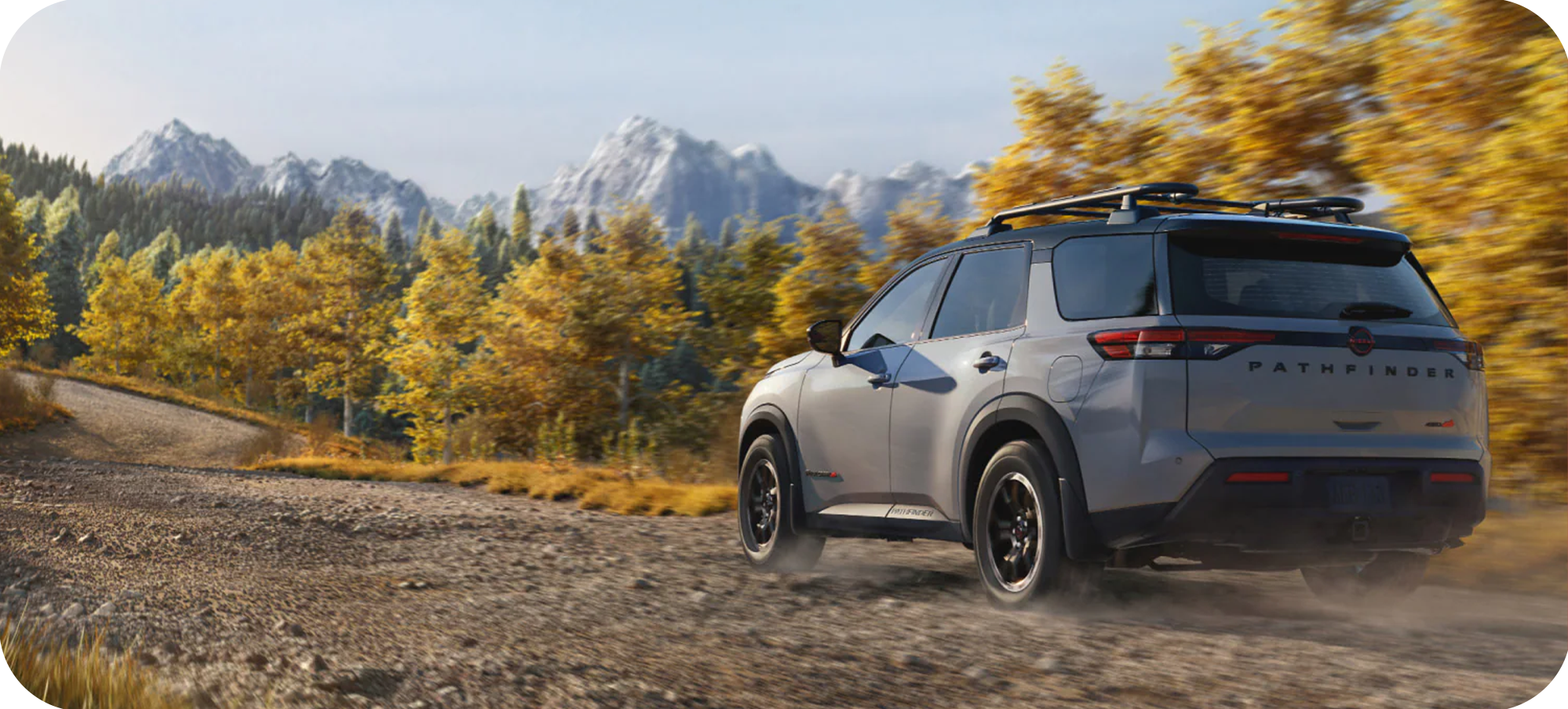 2025 Nissan Pathfinder at Timbrook Nissan | Rear profile of a grey 2026 Nissan Pathfinder driving down a dirt road 2025 Nissan Pathfinder at Timbrook Nissan | Rear profile of a grey 2026 Nissan Pathfinder driving down a dirt road