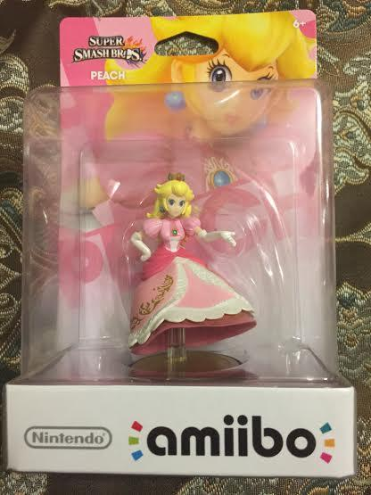 Princess Peach amiibo factory defect: figure inside the sealed box is missing both legs.