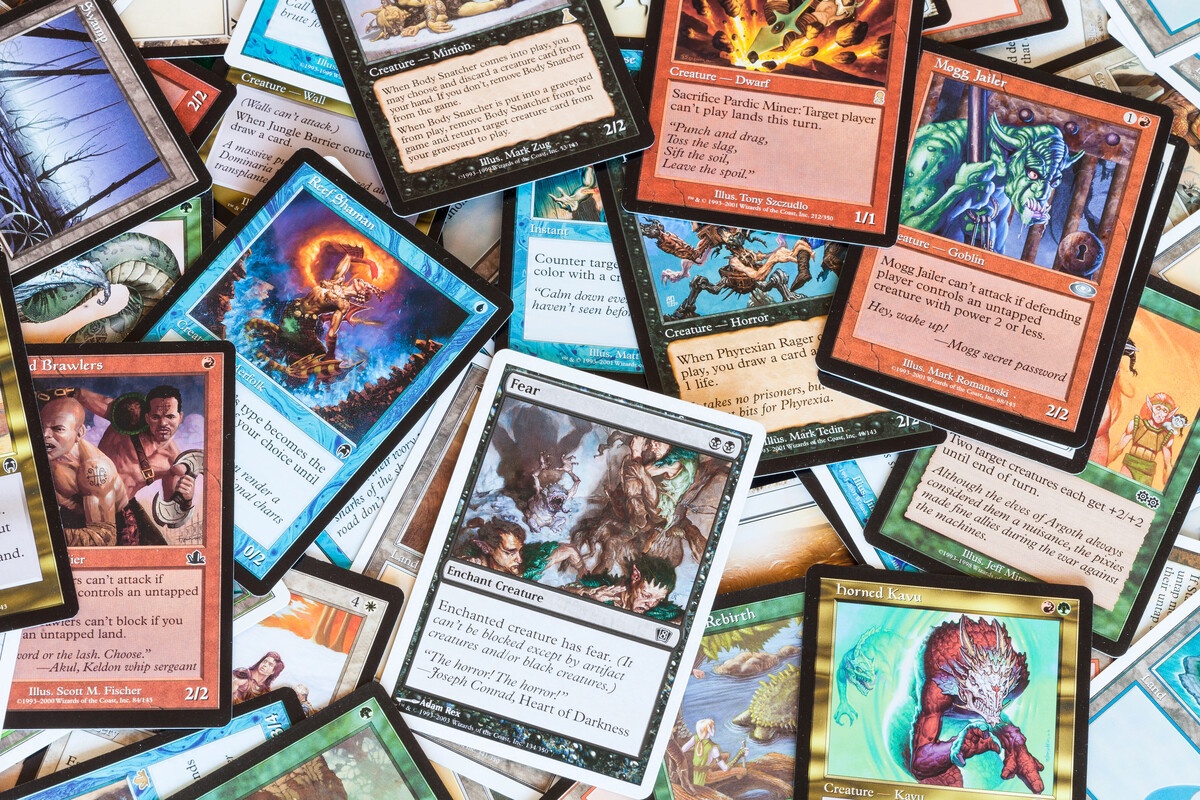 MTG cards in a colorful pile showing mixed collection in overhead view