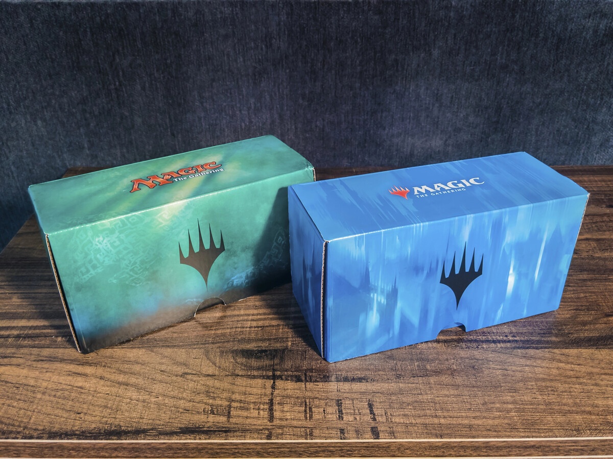 MTG two deck boxes in green and blue branded storage