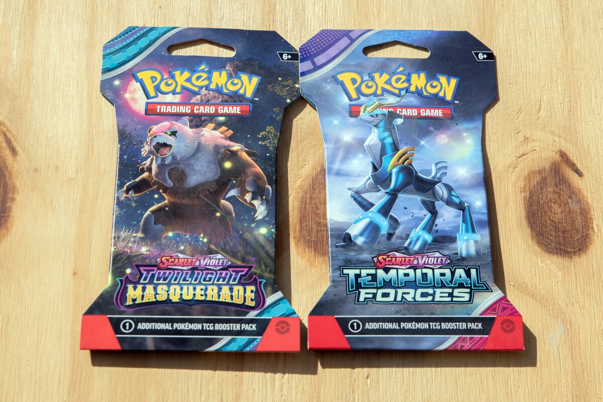 Pokemon sealed sleeved booster packs from Masquerade and Temporal Forces sets