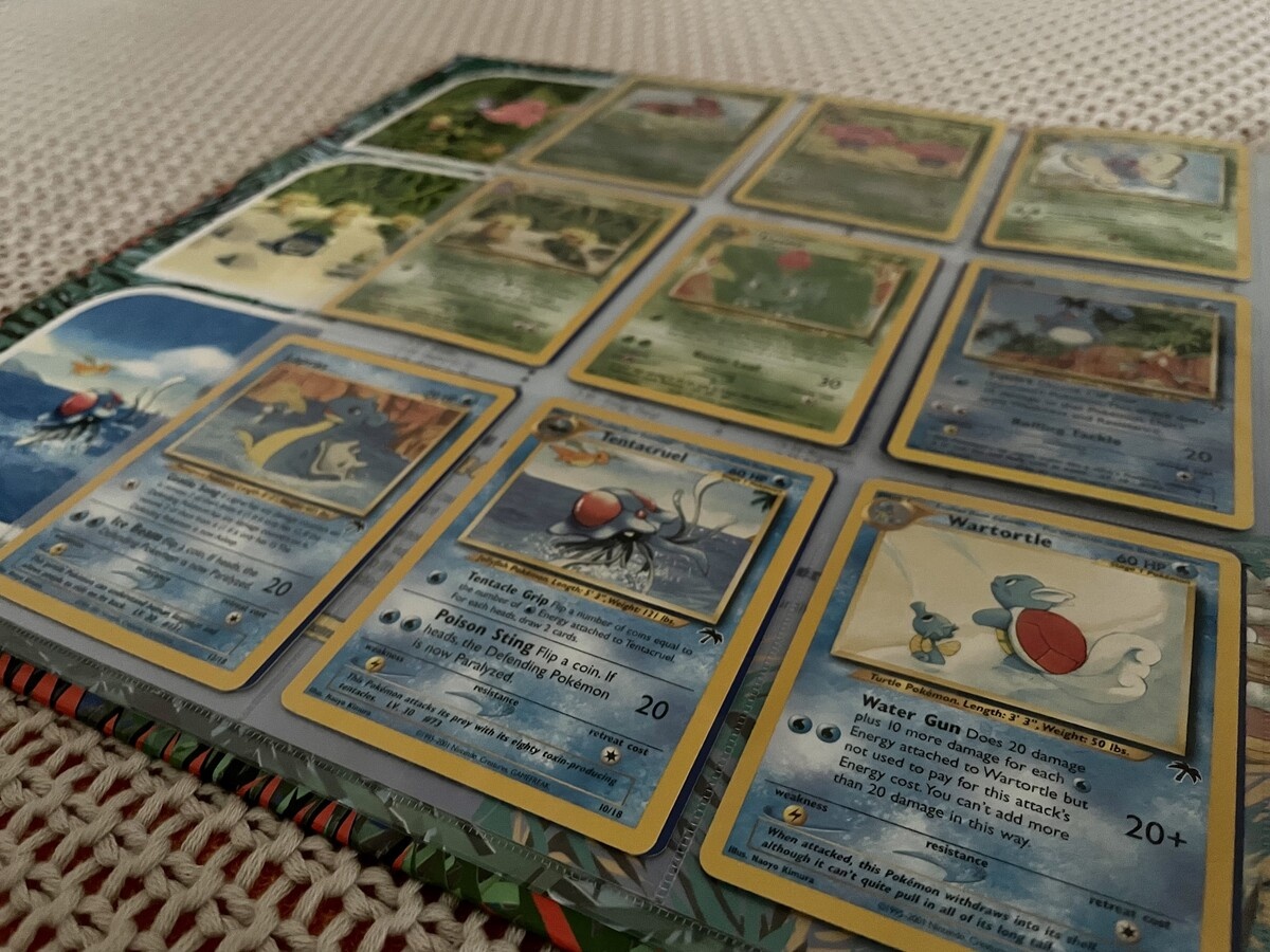 Vintage Pokemon Base Set cards in a binder page evoking nostalgia and investment value