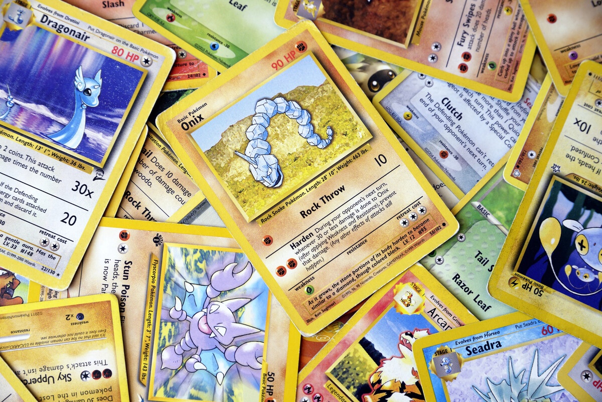 Vintage Pokemon cards scattered in a pile showing closeup detail
