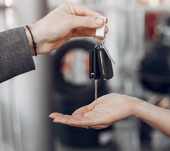 High Cost of Replacing a Car Key | CMA Toyota of Martinsburg | Man handing over his car keys to have them replaced with new keys 