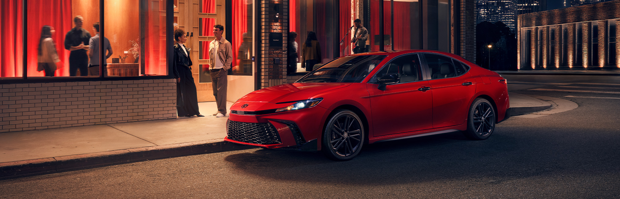 2026 Toyota Camry at CMA's Toyota of Martinsburg in Martinsburg, WV | Red 2026 Toyota Camry parked on the side of the road