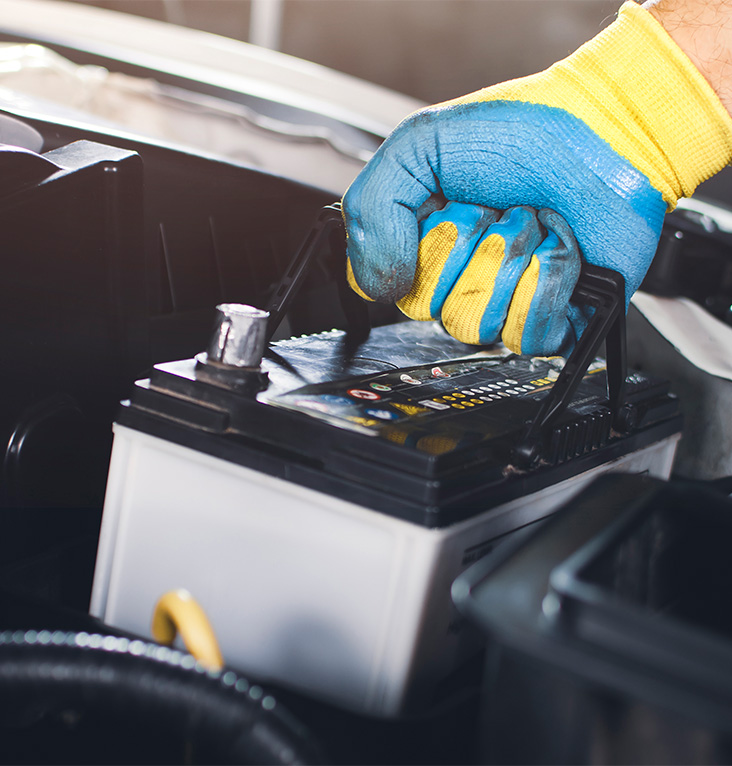 Everything You Need to Know about Your Car Battery at CMA's Toyota of Martinsburg | Person with blue glove holding a car battery