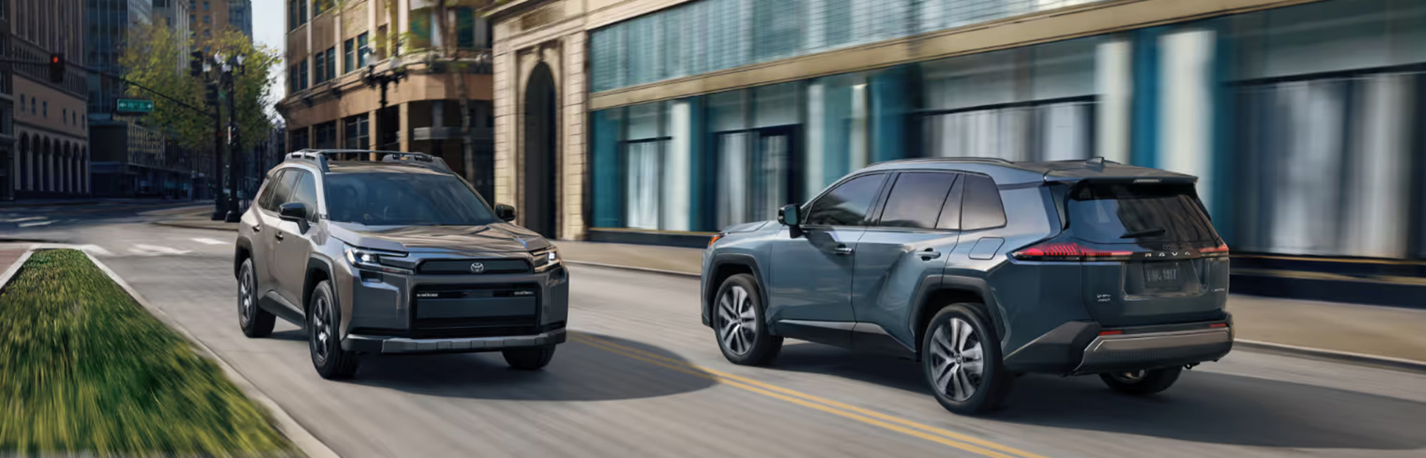 2026 Toyota RAV4 at CMA's Toyota of Martinsburg in Martinsburg, WV | Two 2026 Toyota RAV4's driving past one another on the street