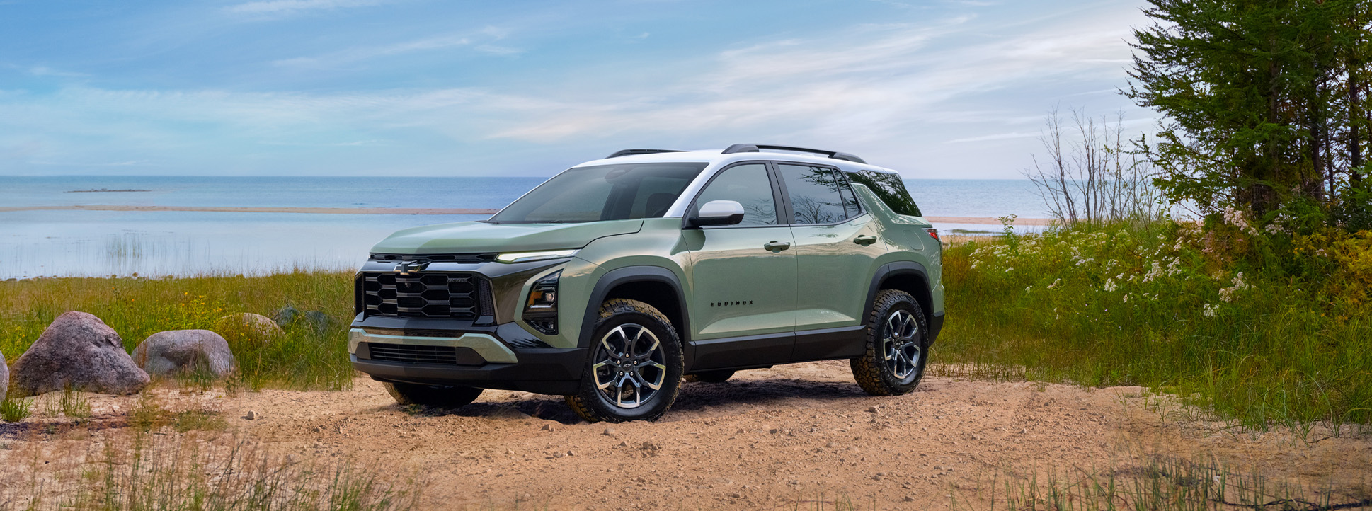 2025 Chevrolet Equinox at Delaney Chevrolet of Greensburg | Green 2025 Chevy Equinox parked on the sand near a beach