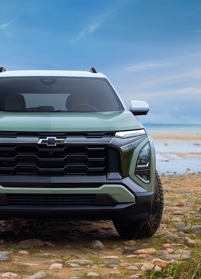 2025 Chevrolet Equinox at Delaney Chevrolet of Greensburg | Close up of the front grill of a green 2025 Chevy Equinox