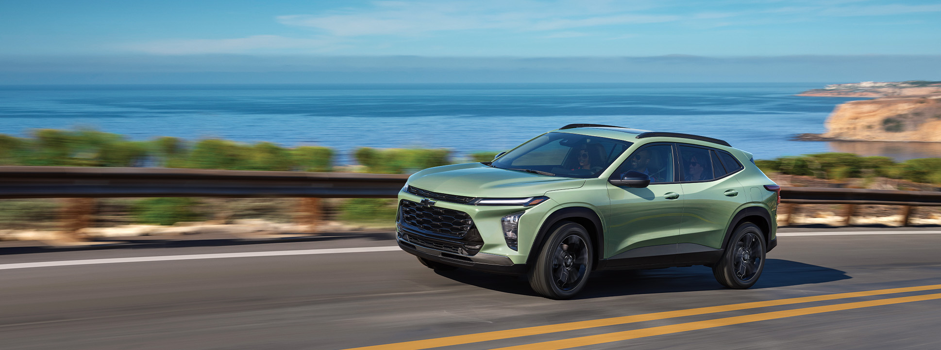 2025 Chevrolet Trax at Delaney Chevrolet of Greensburg | green 2025 Chevy Trax driving up a hill