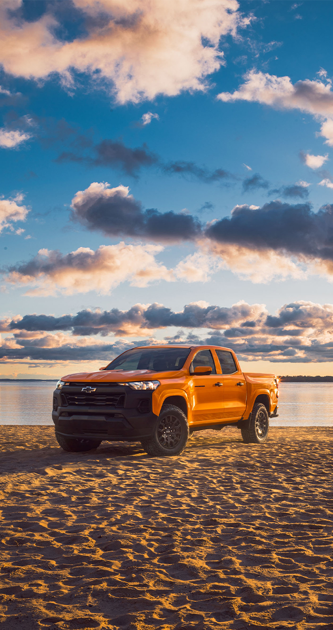 2026 Chevrolet Colorado at Delaney Chevrolet of Greensburg | Orange 2026 Chevrolet Colorado parked by the beach 2026 Chevrolet Colorado at Delaney Chevrolet of Greensburg | Orange 2026 Chevrolet Colorado parked by the beach