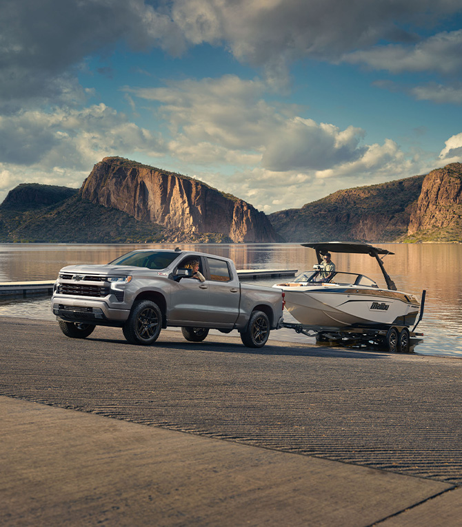 2026 Chevrolet Silverado 1500 at Delaney Chevrolet of Indiana | Grey 2026 Chevrolet Silverado towing a boat out of the lake 2026 Chevrolet Silverado 1500 at Delaney Chevrolet of Indiana | Grey 2026 Chevrolet Silverado towing a boat out of the lake
