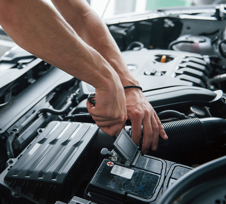 Everything You Need to Know about Your Car Battery at Delaney Chevrolet of Indiana | Person lifting car battery lid 