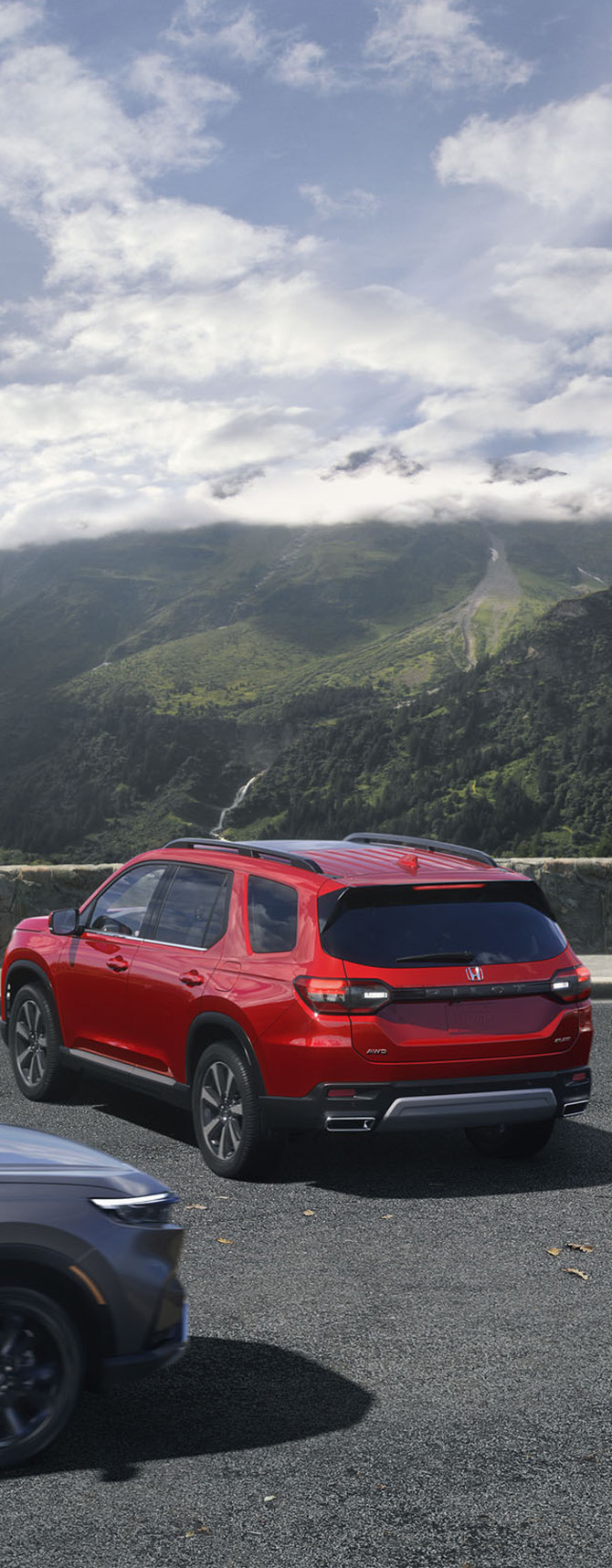 New 2025 Honda Pilot at Delaney Honda | Rear profile of a red 2025 Honda Pilot reversing from a parking spot New 2025 Honda Pilot at Delaney Honda | Rear profile of a red 2025 Honda Pilot reversing from a parking spot