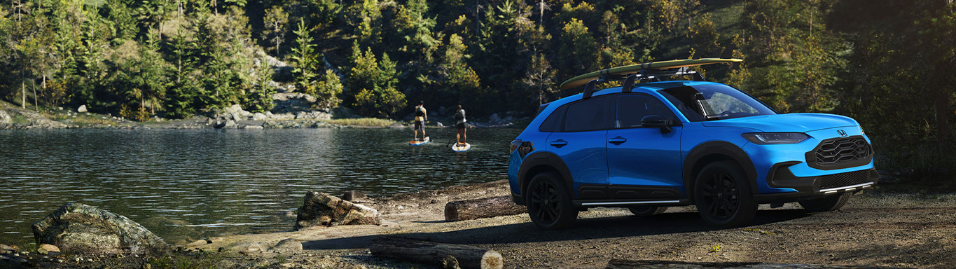 New 2026 Honda HR-V at Delaney Honda | New 2026 Honda HR-V parked beside a river with people paddle boarding New 2026 Honda HR-V at Delaney Honda | New 2026 Honda HR-V parked beside a river with people paddle boarding
