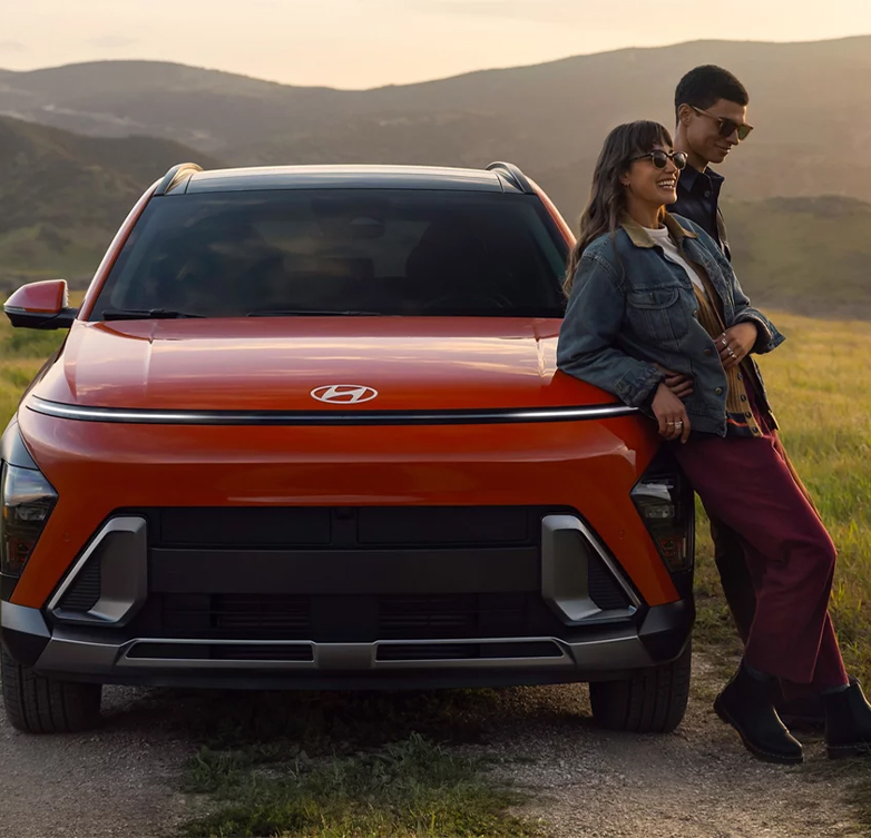  2026 Hyundai Kona at Delaney Hyundai of Dubois | Couple leaning on top of their new 2026 Hyundai Kona