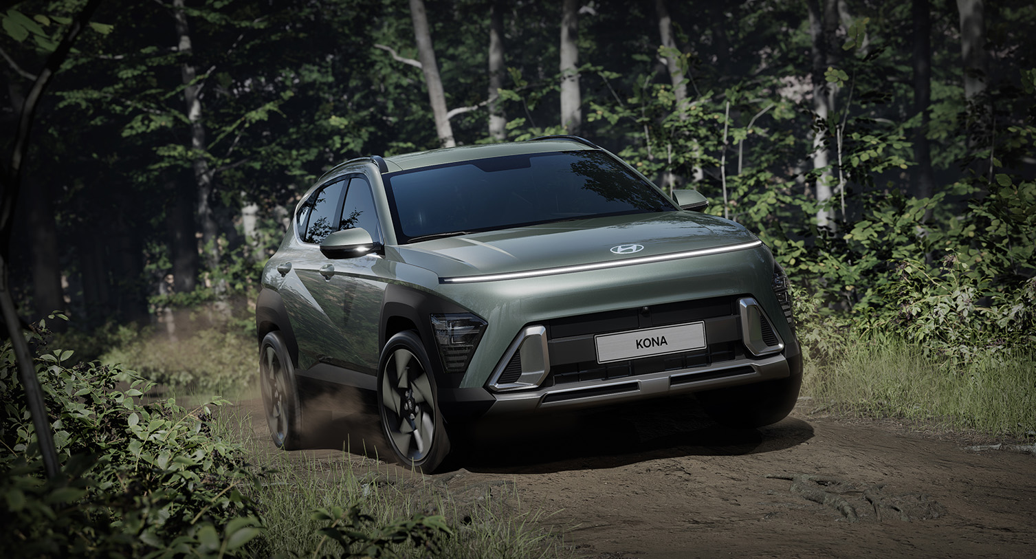 2025 Hyundai Kona at Delaney Hyundai of Indiana | Green 2025 Hyundai Kona Driving on Dirt Road Through Woods