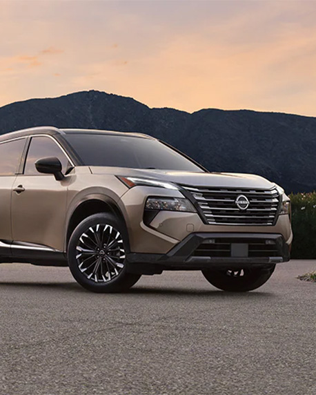 2026 Nissan Rogue at Delaney Nissan of Greensburg | Front profile of a 2026 Nissan Rogue parked in front of some mountains 2026 Nissan Rogue at Delaney Nissan of Greensburg | Front profile of a 2026 Nissan Rogue parked in front of some mountains