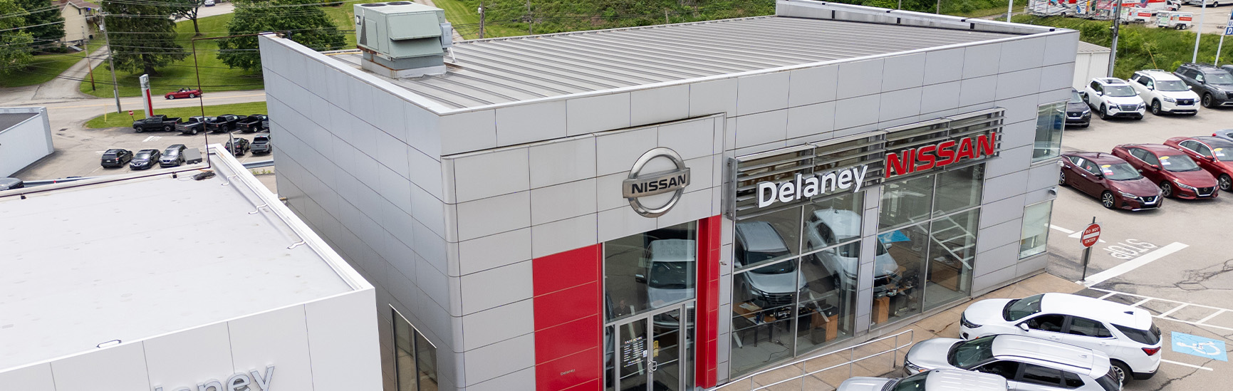 Why drivers should consider an extended warranty on their Nissan at Delaney Nissan of Greensburg | Outside view of Delaney Nissan of Greensburg dealership