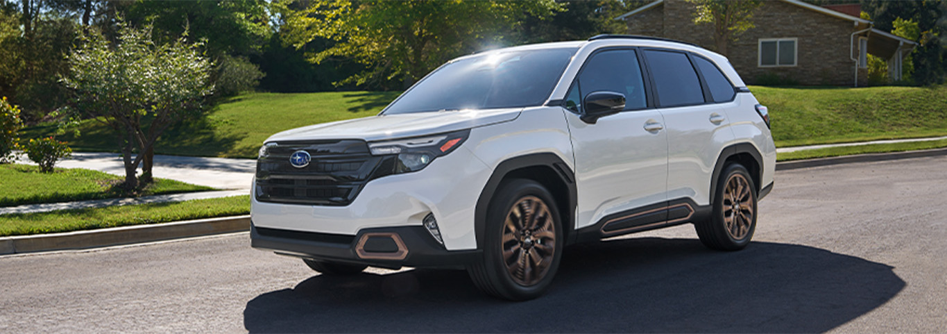 2026 Subaru Forester at Delaney Subaru in Indiana, PA | White 2026 Subaru Forester driving in a neighborhood