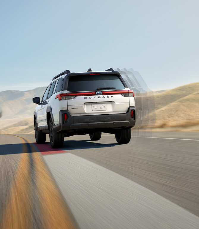 2026 Subaru Outback at Delaney Subaru in Indiana, PA | Rear profile of a white 2026 Subaru Outback driving fast on the road