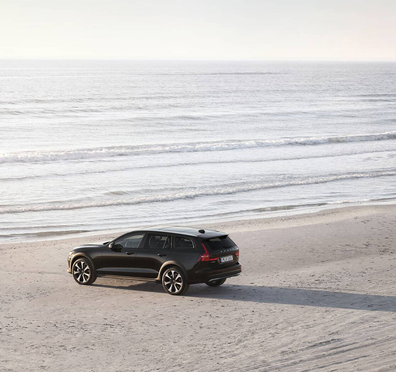 2025 Volvo V60 | Black 2025 Volvo V60 parked on the the beach
