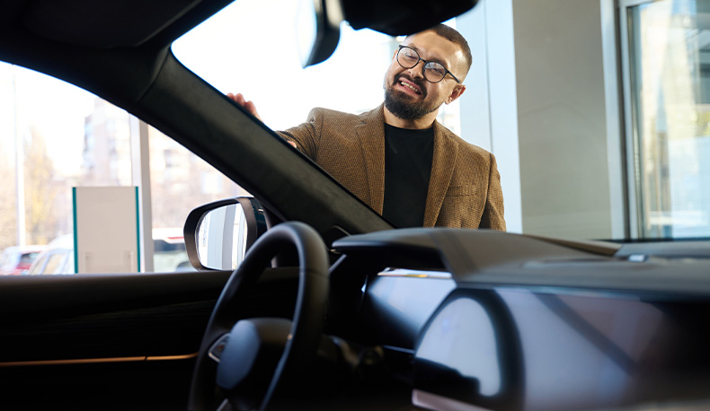 The Advantages of Buying a Car from a Dealership vs. a Private Seller. Learn more at Lancaster Toyota in East Petersburg, PA | Man in brown suit checking out a new car by touching the front windshield The Advantages of Buying a Car from a Dealership vs. a Private Seller. Learn more at Lancaster Toyota in East Petersburg, PA | Man in brown suit checking out a new car by touching the front windshield