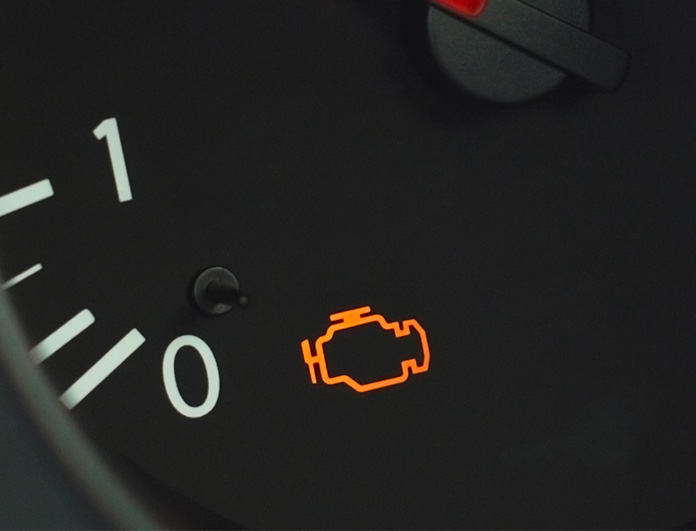 Check Engine Light Diagnostics at Lancaster Toyota | Close up of check engine light displayed on dashboard