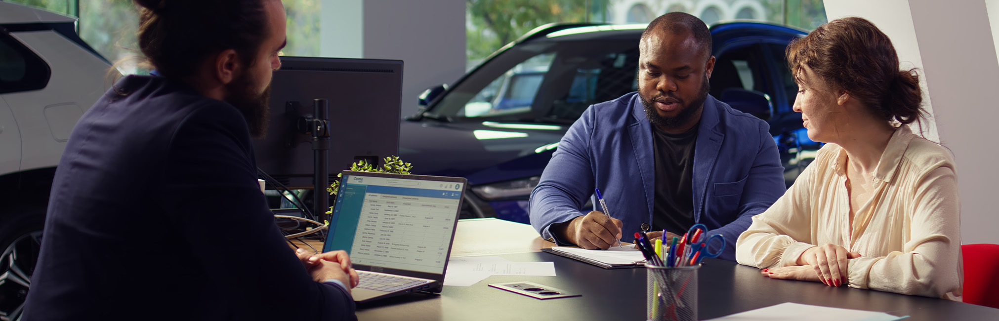 When to Trade In Your Car | Lancaster Toyota in East Petersburg, PA | Couple signing paperwork after their trade-in When to Trade In Your Car | Lancaster Toyota in East Petersburg, PA | Couple signing paperwork after their trade-in