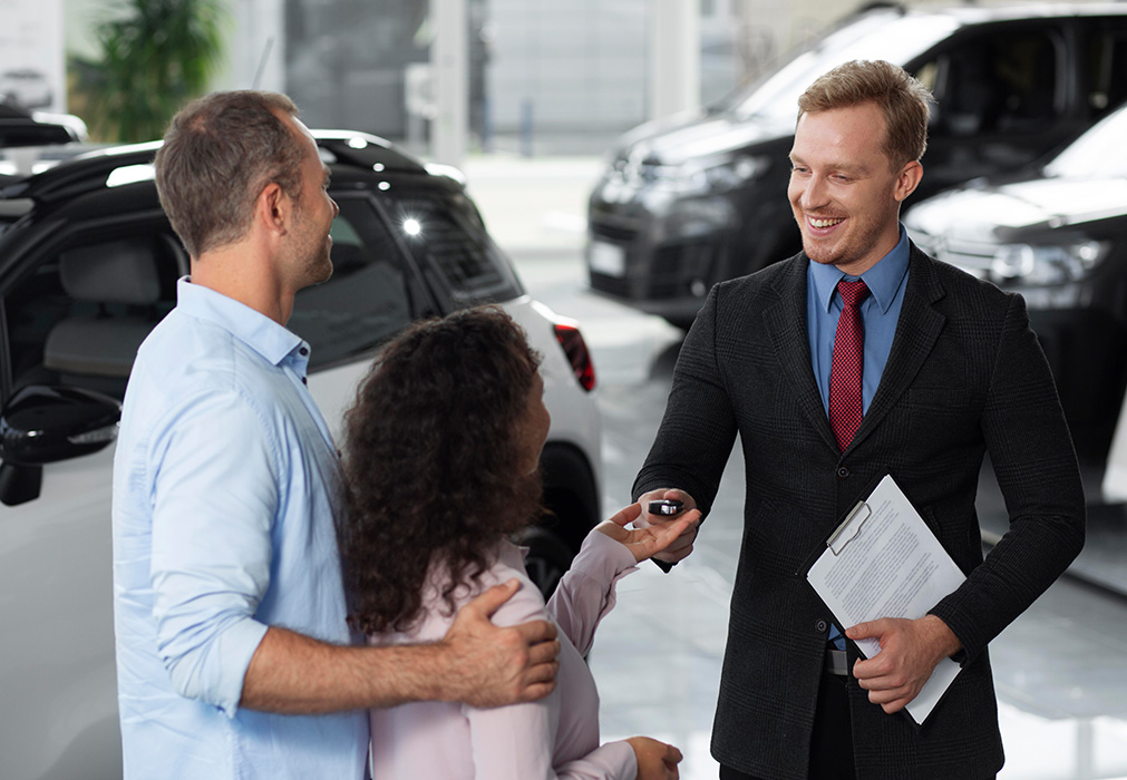 When to Trade In Your Car | Lancaster Toyota in East Petersburg, PA | Salesman handing keys to happy customers When to Trade In Your Car | Lancaster Toyota in East Petersburg, PA | Salesman handing keys to happy customers