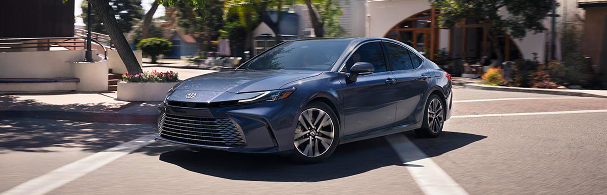 2026 Toyota Camry at Palmiero Toyota in Meadville, PA | New 2026 Toyota Camry making a turn down a city street 2026 Toyota Camry at Palmiero Toyota in Meadville, PA | New 2026 Toyota Camry making a turn down a city street