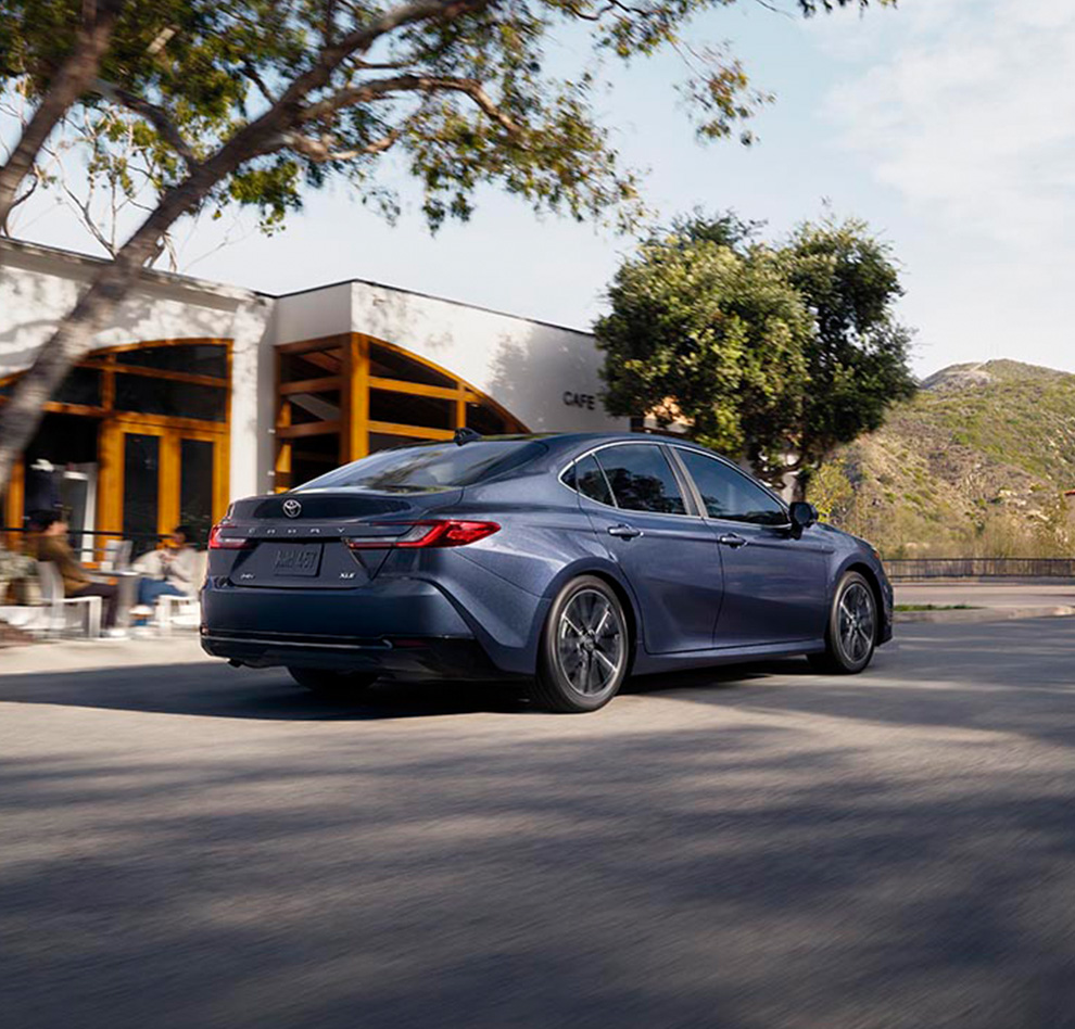 2026 Toyota Camry at Palmiero Toyota in Meadville, PA | Rear view of the New 2026 Toyota Camry driving down a road 2026 Toyota Camry at Palmiero Toyota in Meadville, PA | Rear view of the New 2026 Toyota Camry driving down a road