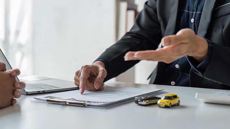 The Advantages of Buying a Car from a Dealership vs. a Private Seller. Learn more at Palmiero Toyota in Meadville, PA | Person showing the finance options for their new car