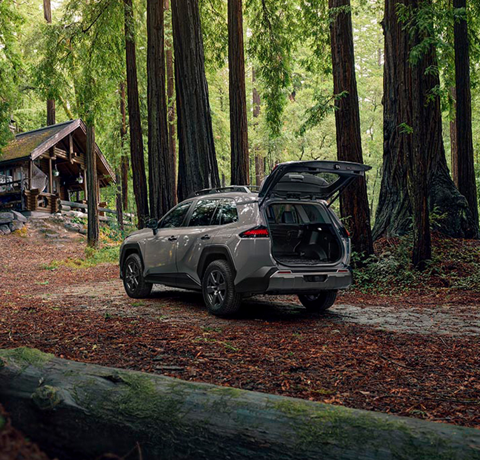 2026 Toyota RAV4 at Palmiero Toyota in Meadville, PA | open trunk of a 2026 Toyota RAV4 parked in the middle of a forest