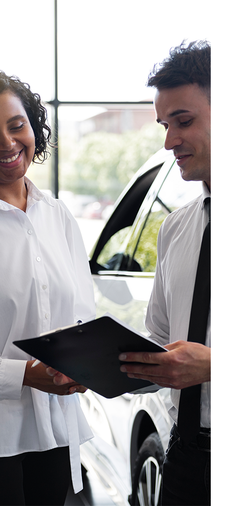 Defining APR at Palmiero Toyota in Meadville, PA | Sales person showing customer the APR rates on clipboard  