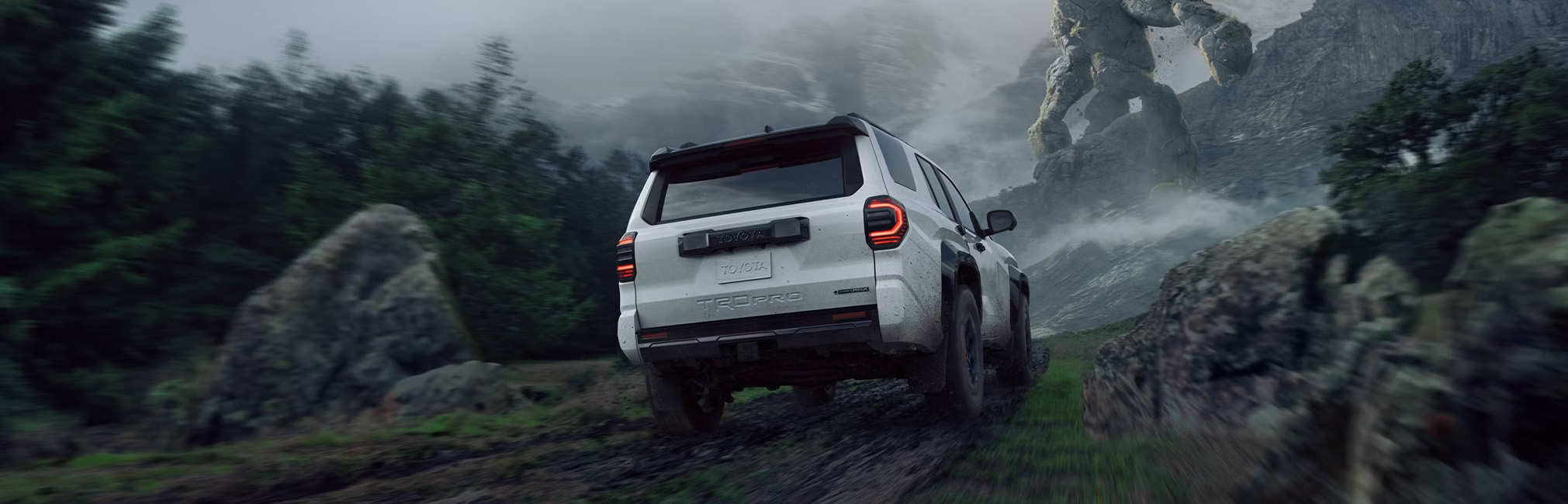 The New 2026 Toyota 4Runner at CMA's Toyota of Martinsburg in Martinsburg, WV | Rear profile of a 2026 Toyota 4Runner in the color white driving up a hill