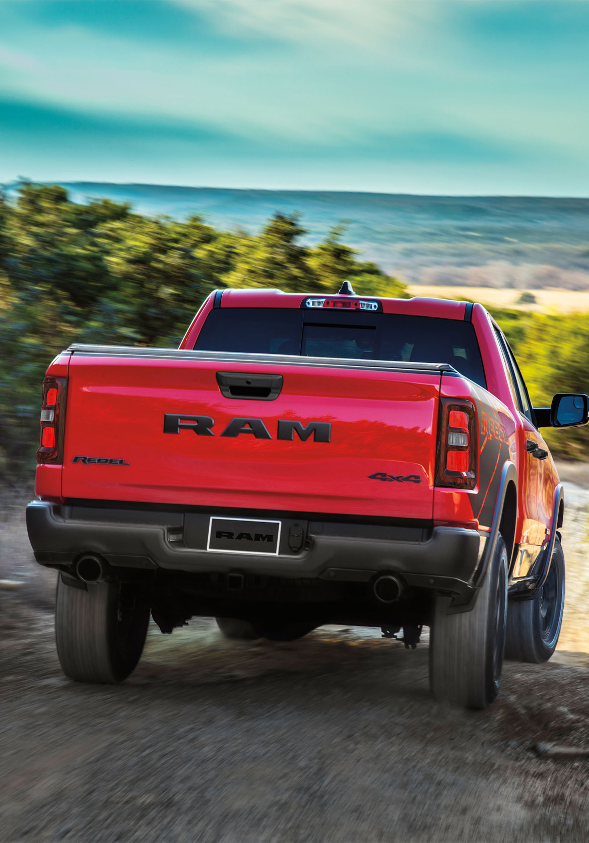 2026 Ram 1500 at CMA's CDJR of Martinsburg | Rear profile of a red 2026 Ram 1500 2026 Ram 1500 at CMA's CDJR of Martinsburg | Rear profile of a red 2026 Ram 1500