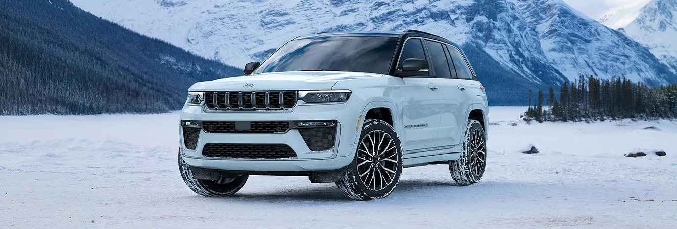 2026 Jeep Grand Cherokee at Delaney CDJR of DuBois | White 2026 Jeep Grand Cherokee parked on the snow