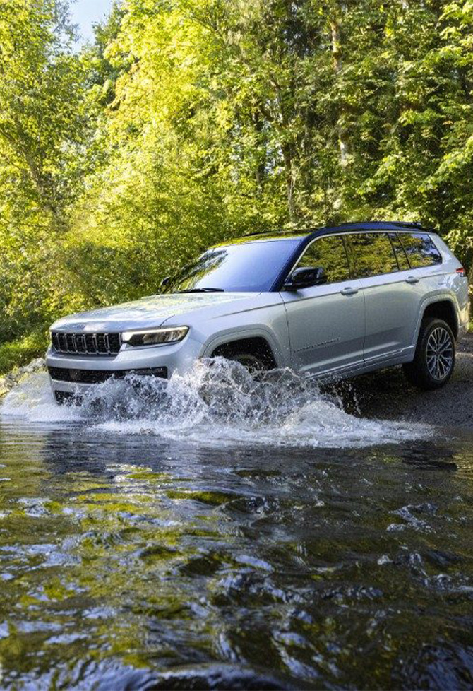2026 Jeep Grand Cherokee at Delaney CDJR of DuBois | 2026 Jeep Grand Cherokee driving into a river