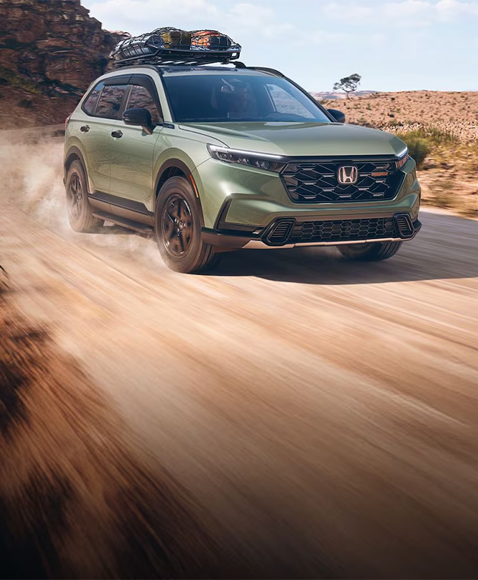New 2026 Honda CR-V at Delaney Honda | Green 2026 Honda Cr-V driving down an off-road trail New 2026 Honda CR-V at Delaney Honda | Green 2026 Honda Cr-V driving down an off-road trail