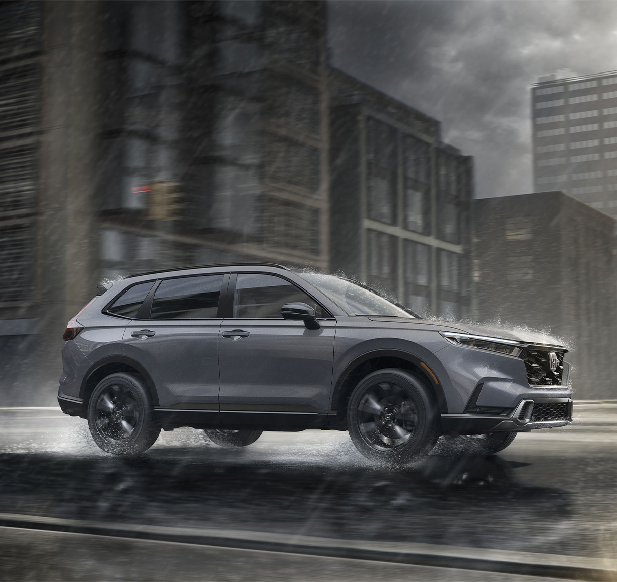 2026 Honda CR-V LX and EX trim comparison at Delaney Honda in Indiana, PA | Grey 2026 Honda CR-V driving in the rain 2026 Honda CR-V LX and EX trim comparison at Delaney Honda in Indiana, PA | Grey 2026 Honda CR-V driving in the rain