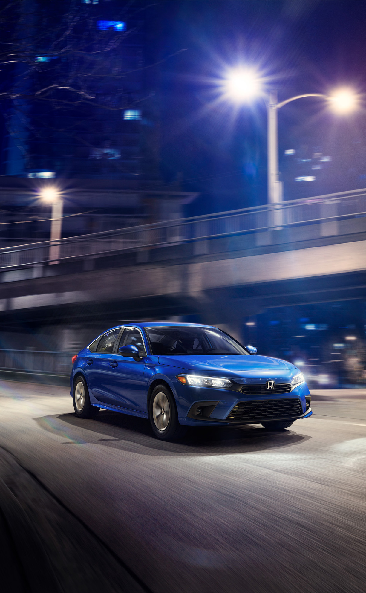 2026 Honda Civic vs. Toyota Corolla vs. Mazda3 vs. Hyundai Elantra comparison | Delaney Honda | Blue 2026 Honda Civic driving down the street 2026 Honda Civic vs. Toyota Corolla vs. Mazda3 vs. Hyundai Elantra comparison | Delaney Honda | Blue 2026 Honda Civic driving down the street