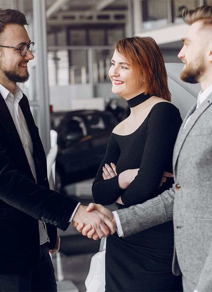 Federal Auto Loan Interest Tax Deduction in Indiana, PA | Customer shaking hands with sales associate inside of dealership Federal Auto Loan Interest Tax Deduction in Indiana, PA | Customer shaking hands with sales associate inside of dealership