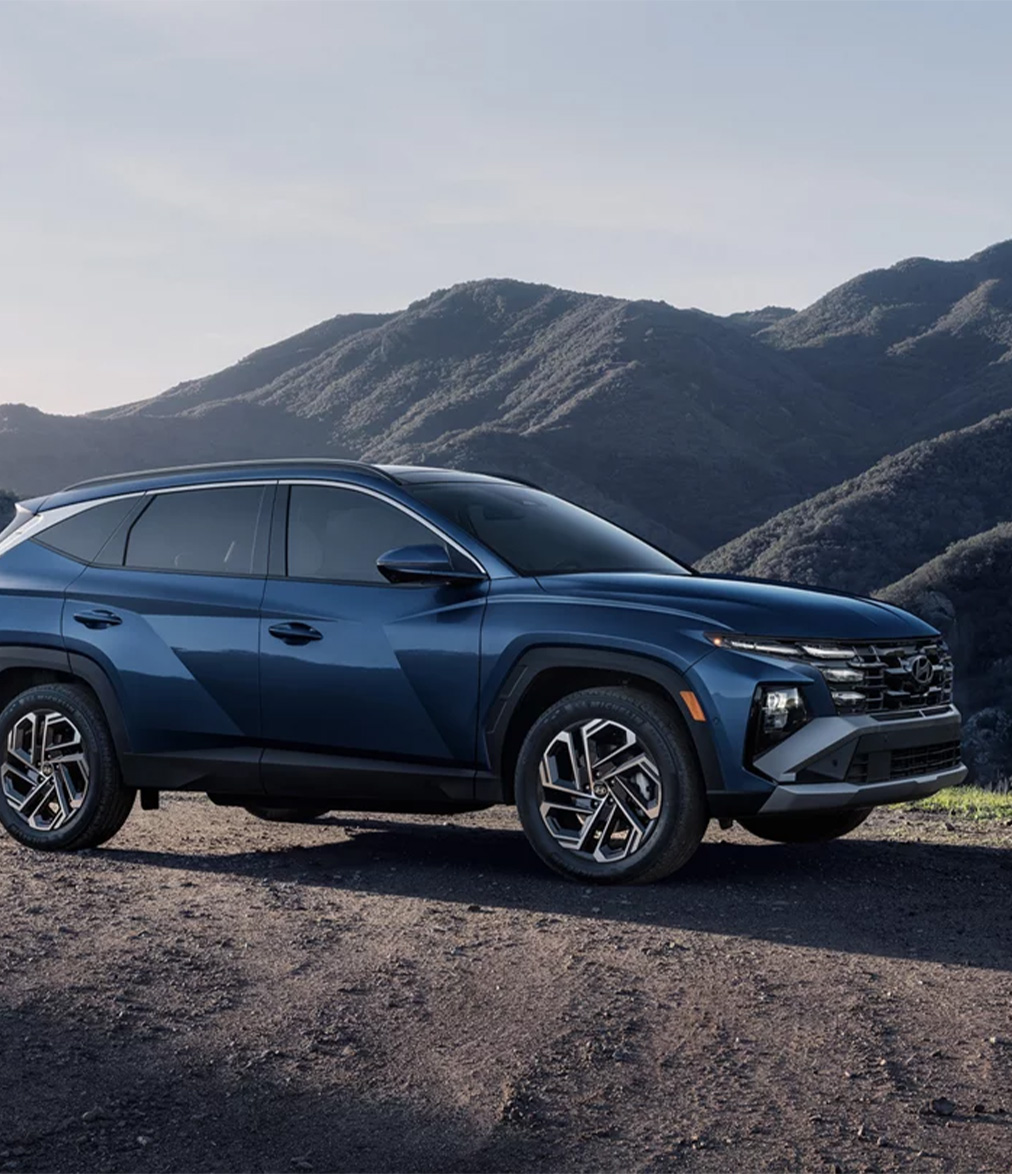2026 Hyundai Tucson at Delaney Hyundai of Dubois | Blue 2026 Hyundai Tucson with a view of the mountains in the back 2026 Hyundai Tucson at Delaney Hyundai of Dubois | Blue 2026 Hyundai Tucson with a view of the mountains in the back