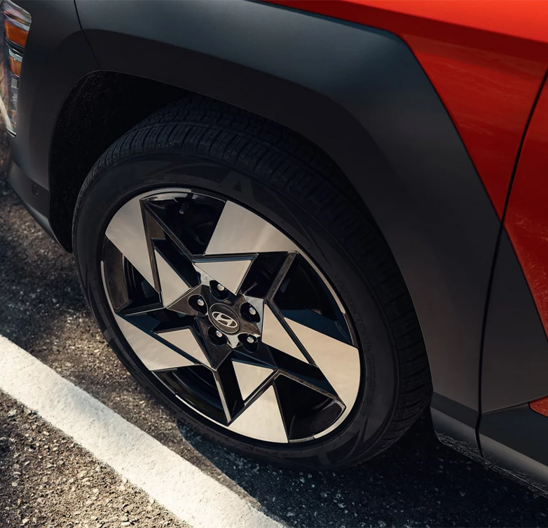  2026 Hyundai Kona at Delaney Hyundai of Indiana | Close up of the wheels of a orange 2026 Hyundai Kona