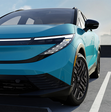 2026 Nissan Leaf at Delaney Nissan of Greensburg | Close up of the headlights to a 2026 Nissan Leaf in the color blue 2026 Nissan Leaf at Delaney Nissan of Greensburg | Close up of the headlights to a 2026 Nissan Leaf in the color blue