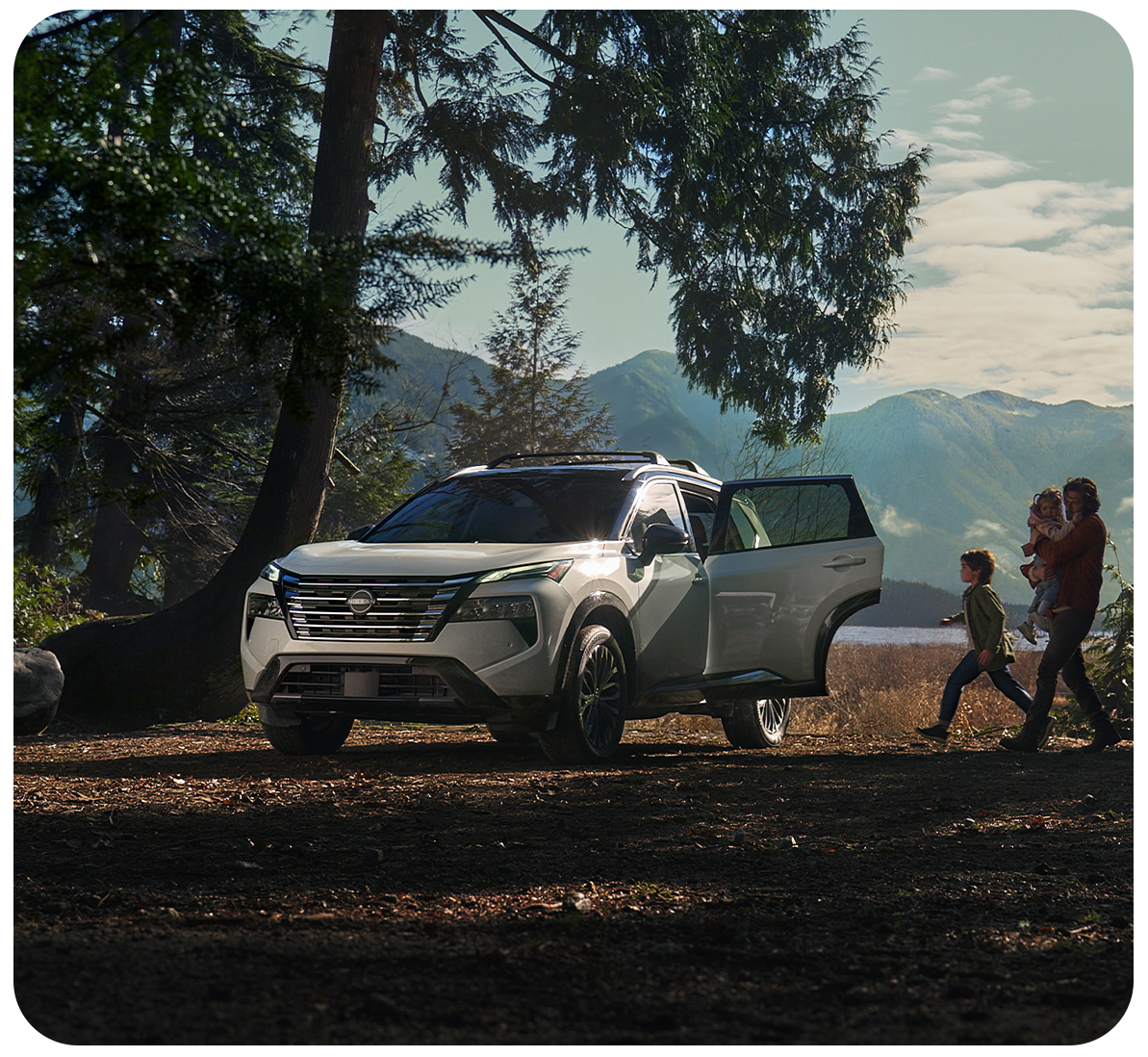 2026 Nissan Rogue vs. 2026 Honda CR-V vs. 2026 Toyota RAV4 at Delaney Nissan of Greensburg in Greensburg, PA | Family walking up to their Silver 2026 Nissan Rogue