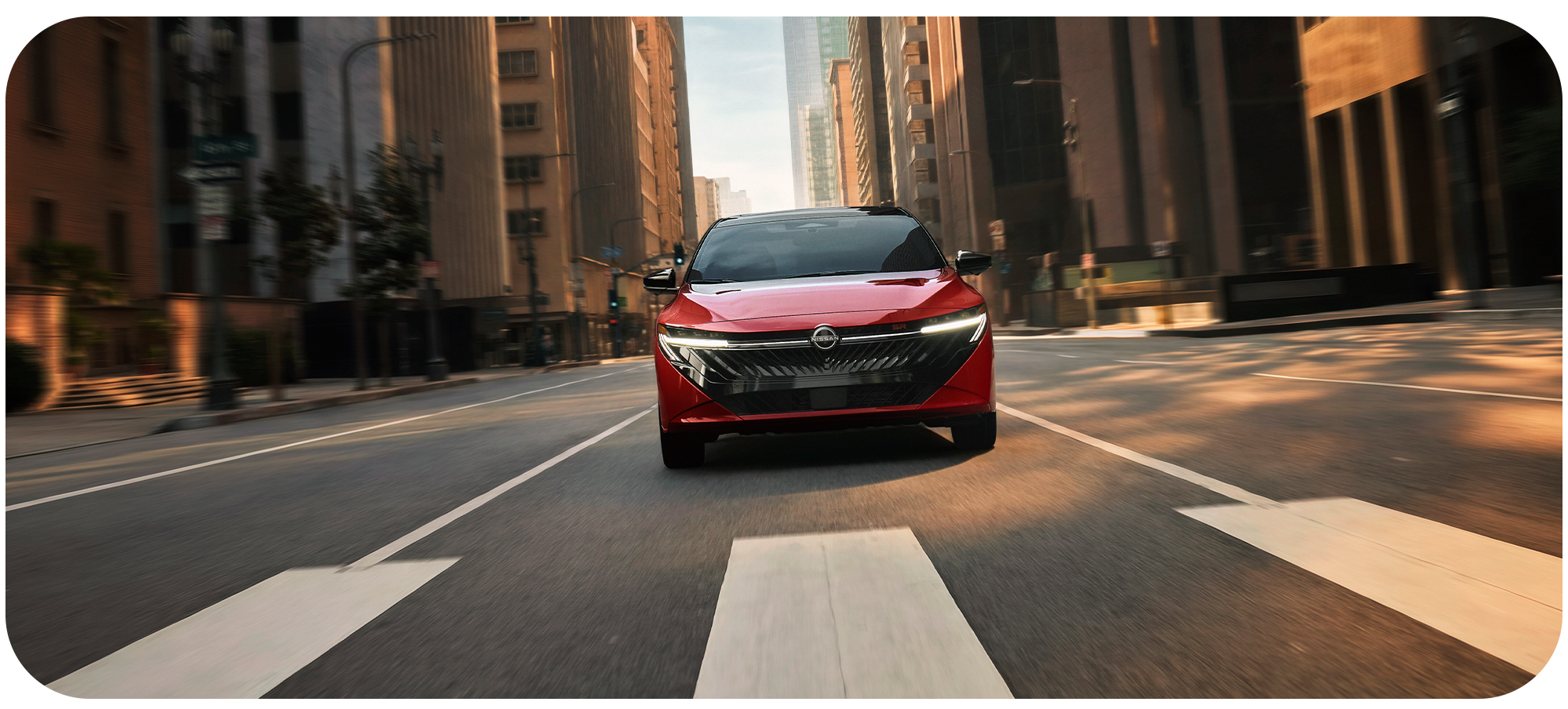 2025 Nissan Sentra at Delaney Nissan of Greensburg | 2026 Nissan Sentra driving down a city road