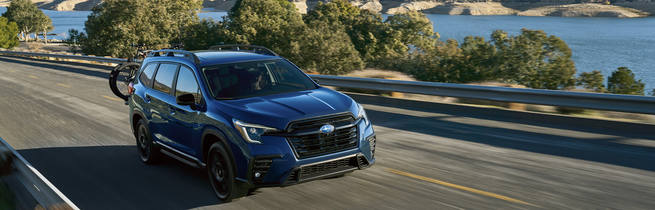 2026 Subaru Ascent at Delaney Subaru in Indiana, PA | Blue 2026 Subaru Ascent driving up the road 2026 Subaru Ascent at Delaney Subaru in Indiana, PA | Blue 2026 Subaru Ascent driving up the road